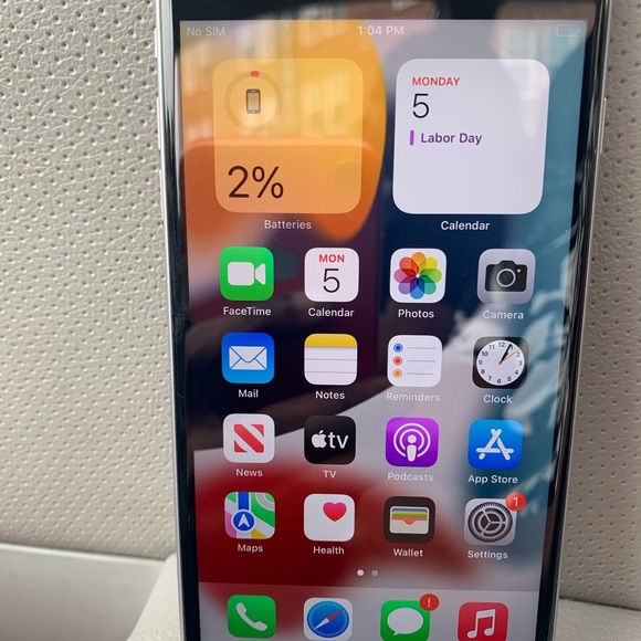 An iPhone 6s Plus with a custom theme, showcasing the potential of jailbreaking for personalization